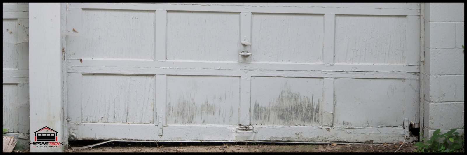 An example of a garage door that needs repair